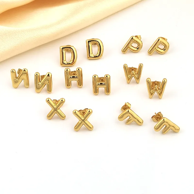 Set of gold letter stud earrings in various designs, waterproof and tarnish-resistant.