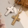 A silver and gold cross pendant, each with its own chain, with the gold cross decorated with cubic zirconia stones, placed over a textured background.