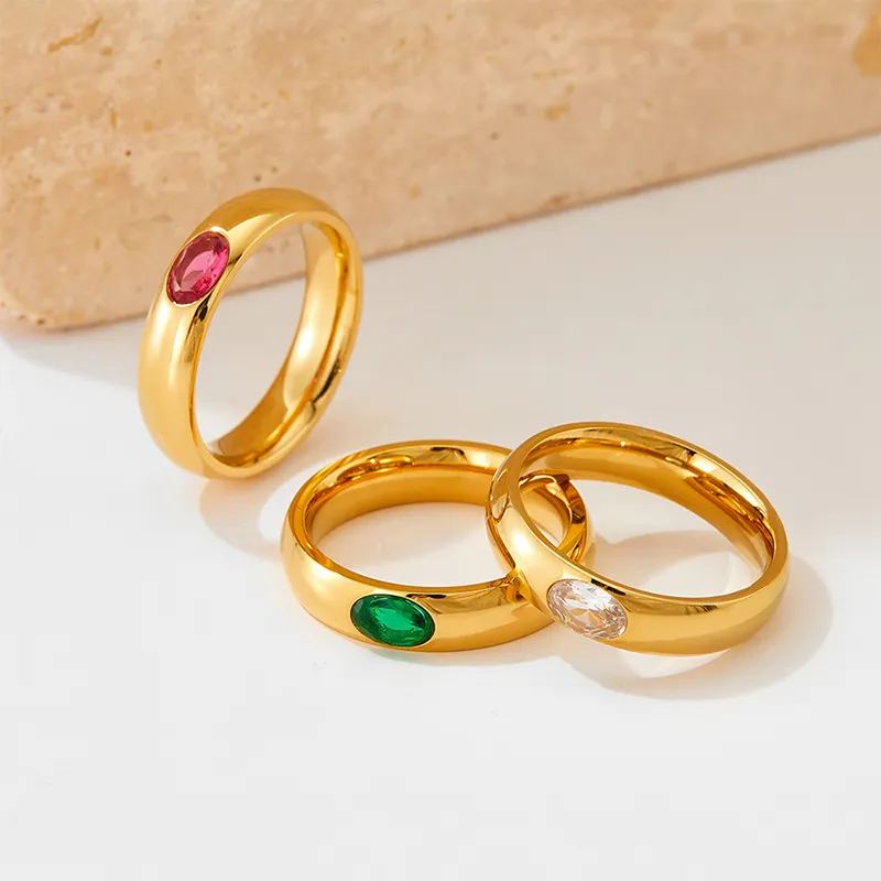 Set of 18K gold rings with pink, green, and clear cubic zirconia gemstones, waterproof and tarnish-resistant.