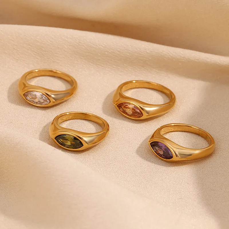 Set of gold rings with marquise-shaped gemstones in purple, green, pink, and clear, waterproof and tarnish-resistant.