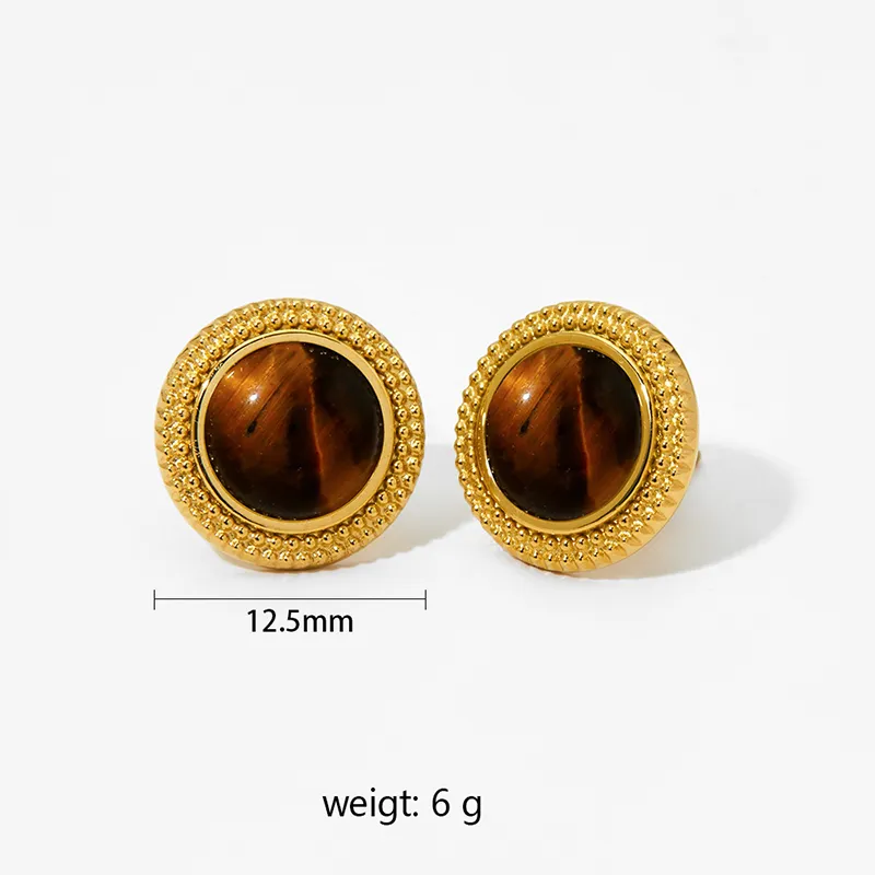 Gold earrings featuring a round tiger eye stone surrounded by gold beading.