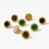 A set of eight gold earrings with black onyx, green agate, tiger's eye, and other gemstone cabochons.