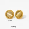 Gold earrings with round cat's eye stones framed by gold beading.