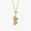 Gold teddy bear pendant with cubic zirconia stones and a star charm on a gold chain, displayed against a white background.