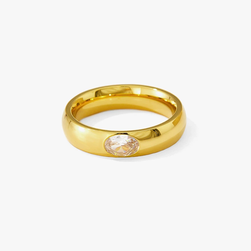 Gold ring with an oval clear cubic zirconia stone.