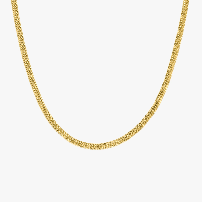 A close-up image of a gold herringbone chain against a white background, showcasing its smooth and flexible design.