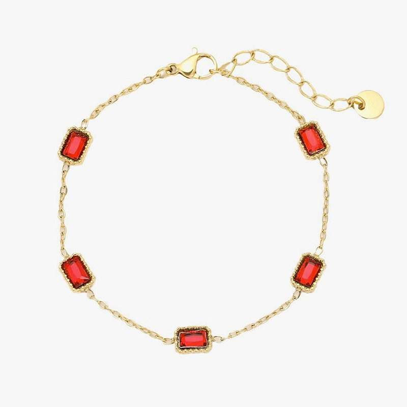 Gold bracelet adorned with five rectangular red cubic zirconia stones, designed with a minimalist gold chain for an elegant look.