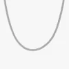 A close-up of a silver herringbone chain against a white background, showcasing its smooth, reflective surface and elegant design.