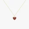18K gold necklace with a heart-shaped red agate pendant, featuring a delicate chain and a timeless design.