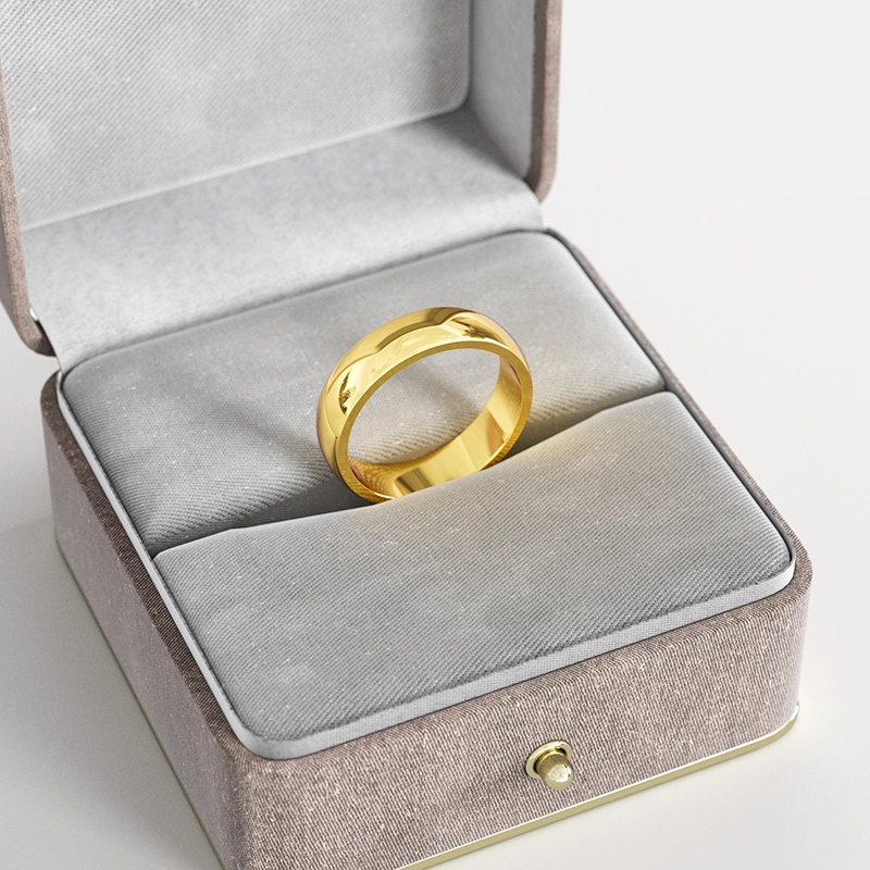 A wide 18K gold-plated band ring with a smooth polished finish, displayed in a gray velvet jewelry box, highlighting its classic and elegant design.