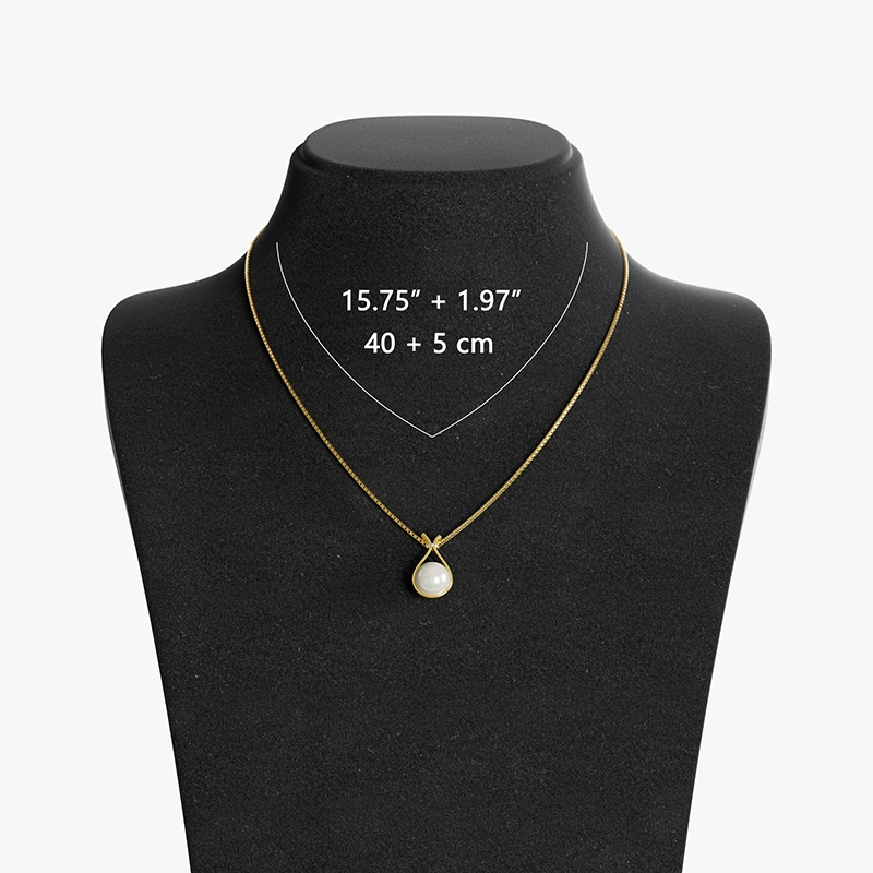 Gold fortune bag-shaped pearl pendant necklace displayed on a black mannequin, featuring a 40cm + 5cm (15.75” + 1.97”) adjustable chain.