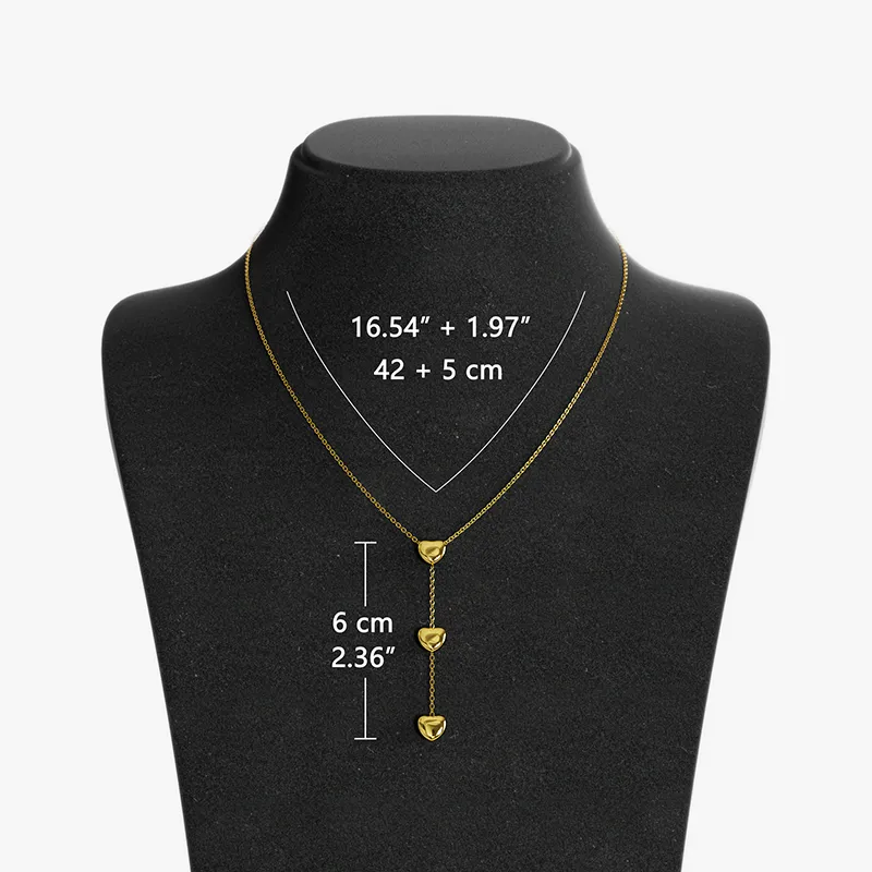 18K gold heart pendant necklace displayed on a black bust, featuring adjustable chain length measurements in inches and cm.