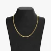 18K gold herringbone chain necklace with a smooth, flat design, displayed on a black velvet bust for a classic and luxurious look.