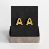 Gold letter "A" stud earrings in a chic gift box.