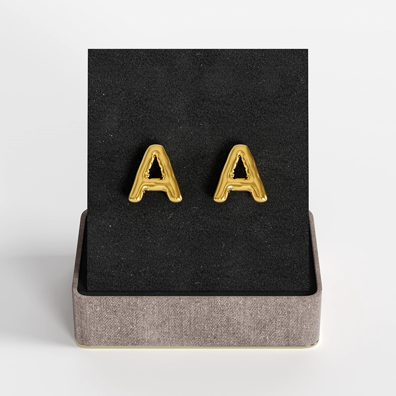 Gold letter "A" stud earrings in a chic gift box.