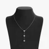 Stainless steel heart pendant necklace displayed on a black velvet bust, featuring three polished heart charms and a delicate chain.