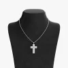 Stainless steel cross pendant necklace with shimmering stones, displayed on a black velvet bust, highlighting its sleek and modern design.